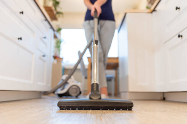 Women cleaning laminate flooring | Thornton Flooring